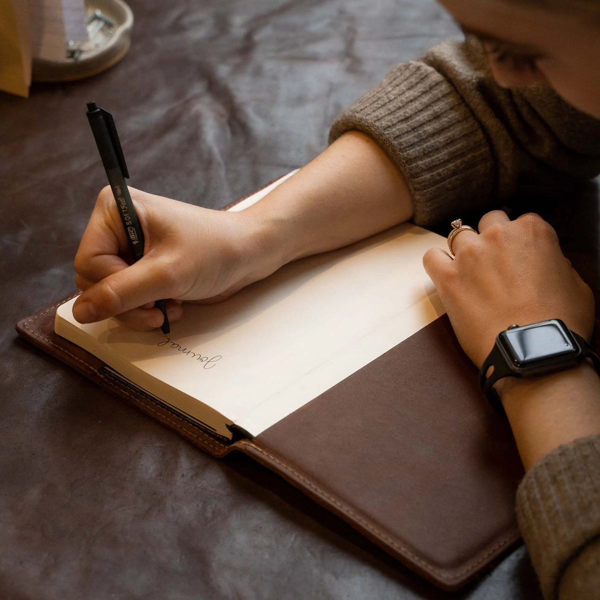 Hand Made Full Grain leather journal cover that comes with a 192 page A5 journal. This journal is handmade and can be personalized with your name or your initials! Available in tan, orange, or dark brown bison shrunken leather.