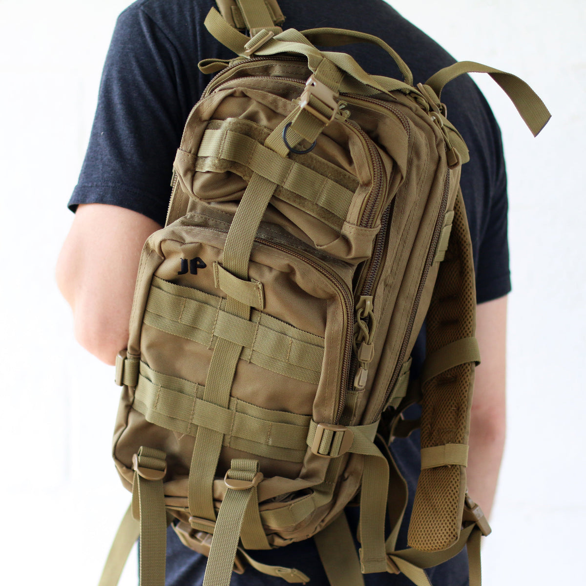 Military style canvas bag over a person&#39;s shoulder