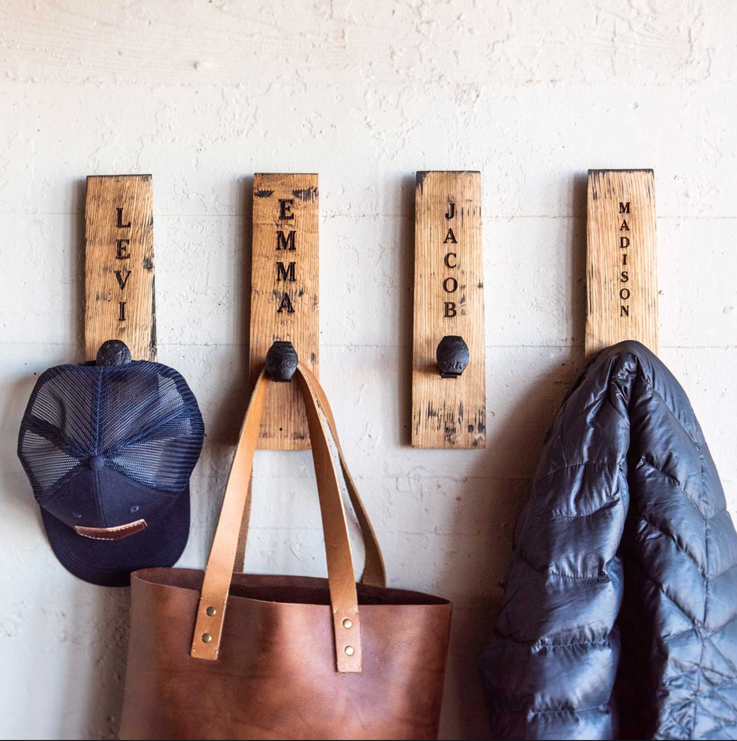 Wall hangers made of Tennessee Whiskey Barrel wood with personalized letters